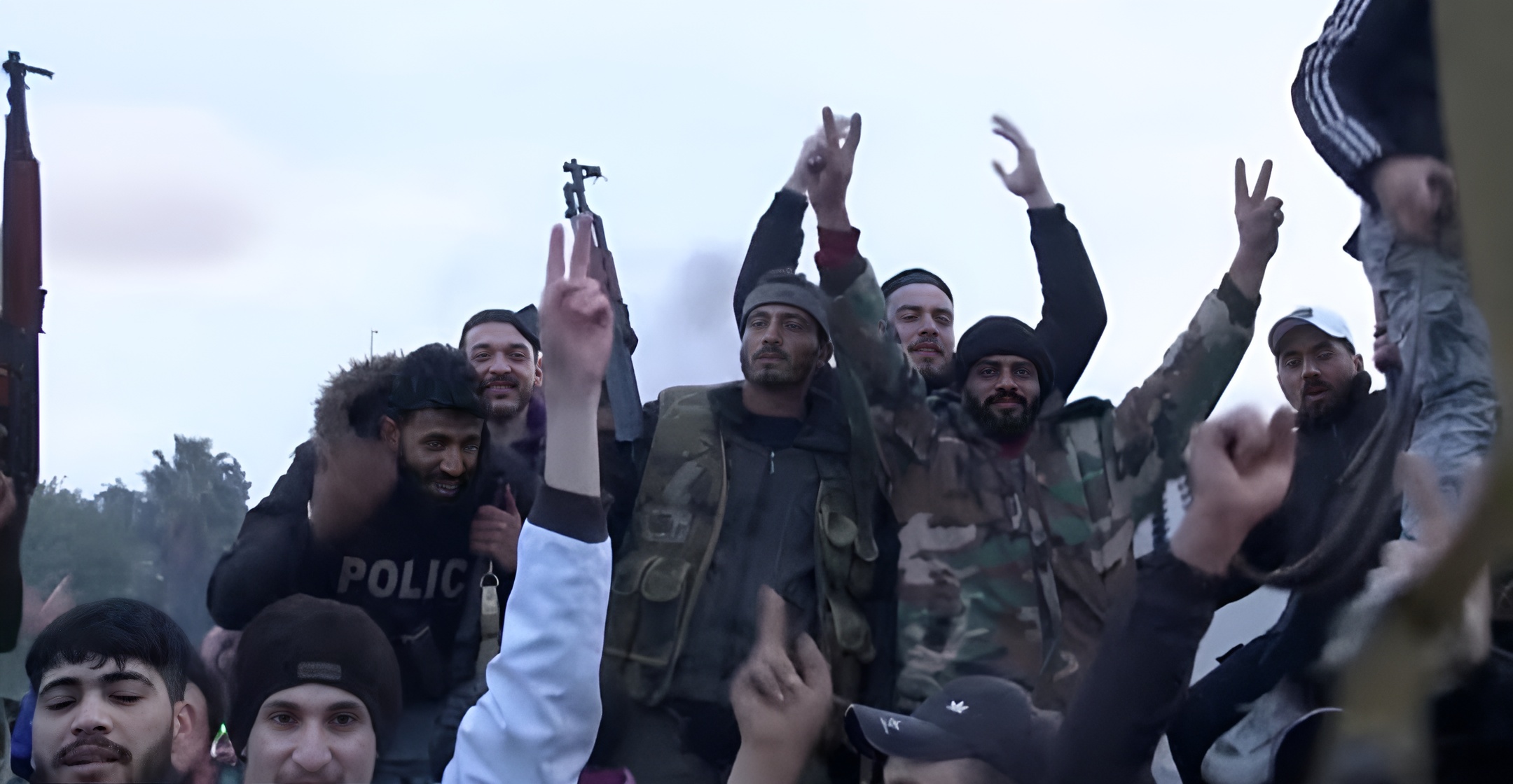 Syrian rebels celebrate on the streets of Damascus